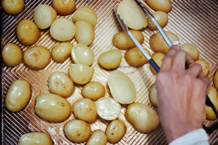 Coat potatoes with EVOO